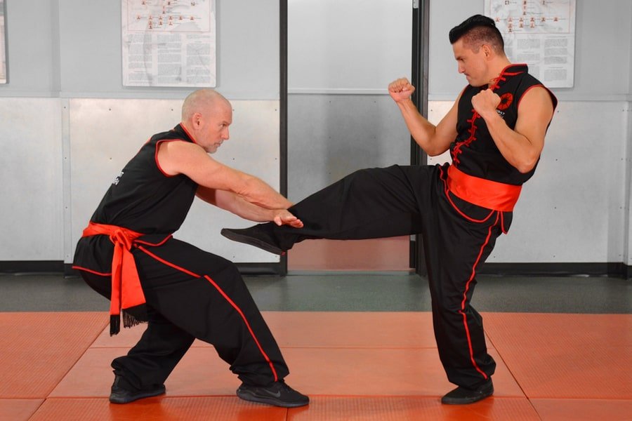 Master Nathan Fisher, Founder of Combat Kung-Fu, Shows How to Block and Take Control of an Attacker's Kicking Leg