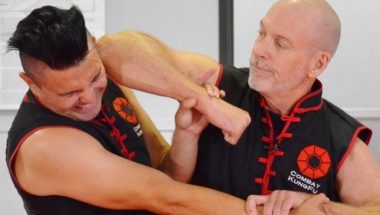 Image of Master Nathan Fisher, Founder of Combat Kung-Fu & 5th Generation Choy Li Fut Master, Showing How to Disable an Attacker with a Close-In Self-Defense Technique